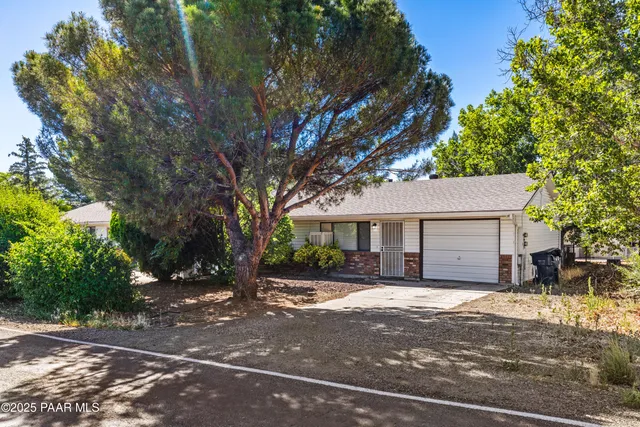 a view of a house with a tree