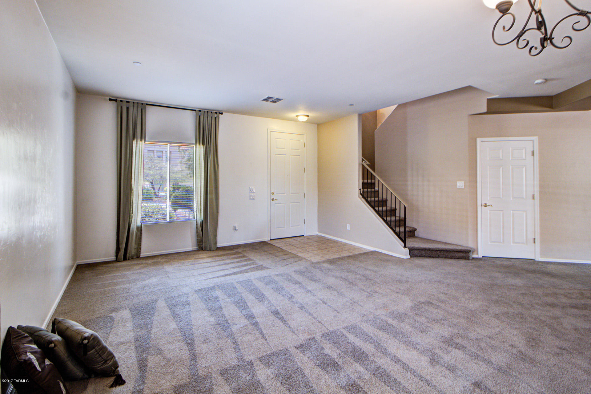 3588 East Mecate Road Tucson, AZ 85739 - Photo 5 of 36 a view of an empty room with stairs