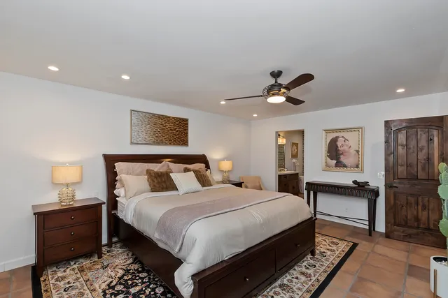 a bed room with a bed and a lamp