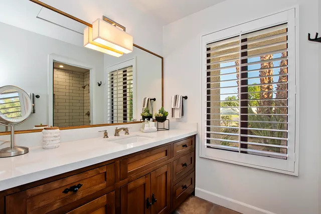 a bathroom with a sink and a mirror