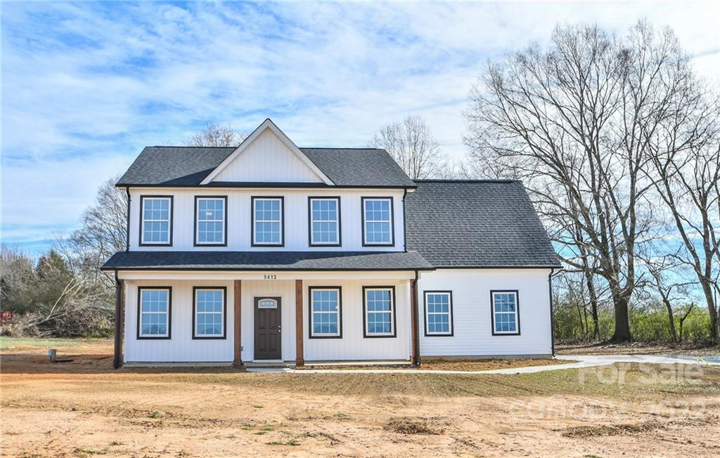 5413 Austin Road, Unit 4 Monroe, NC 28112 - Photo 1 of 22 a front view of a house with a yard