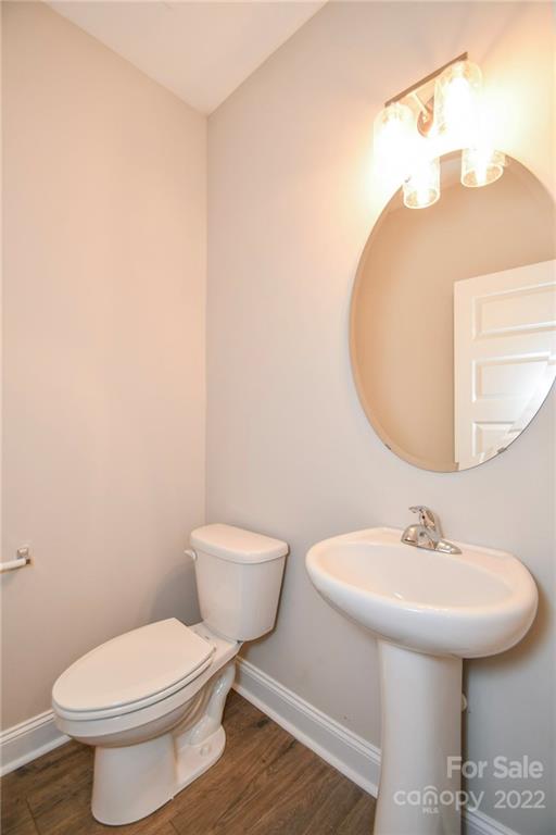 5413 Austin Road, Unit 4 Monroe, NC 28112 - Photo 12 of 22 a bathroom with a toilet sink and mirror