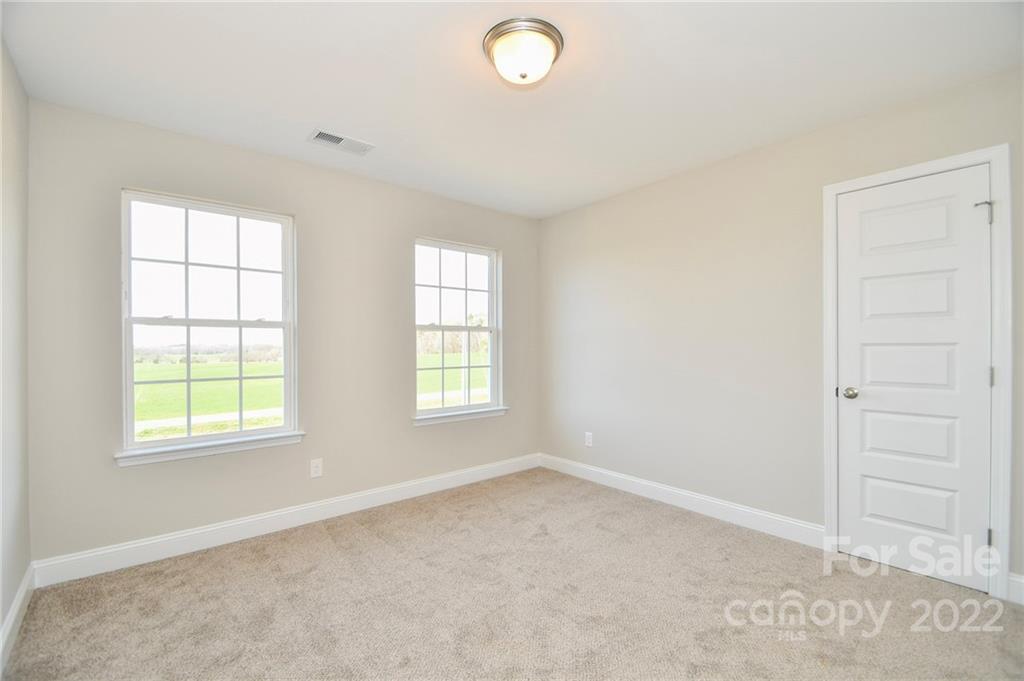 5413 Austin Road, Unit 4 Monroe, NC 28112 - Photo 16 of 22 an empty room with windows and closet