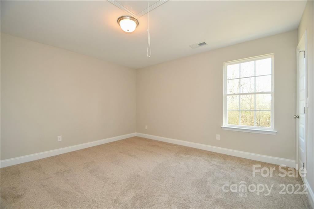 5413 Austin Road, Unit 4 Monroe, NC 28112 - Photo 18 of 22 an empty room with a window