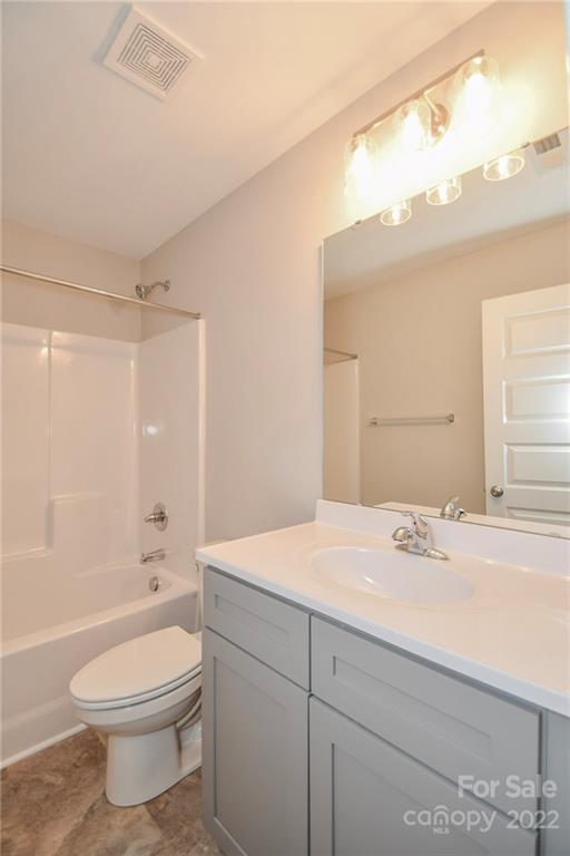 5413 Austin Road, Unit 4 Monroe, NC 28112 - Photo 19 of 22 a bathroom with a sink a toilet and shower