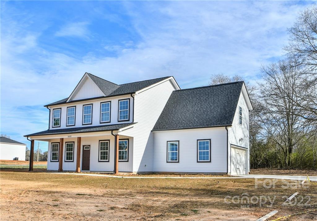 5413 Austin Road, Unit 4 Monroe, NC 28112 - Photo 2 of 22 a front view of a house with a yard