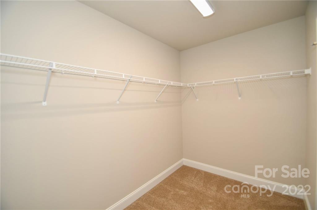 5413 Austin Road, Unit 4 Monroe, NC 28112 - Photo 22 of 22 a view of a room with racks on the wall
