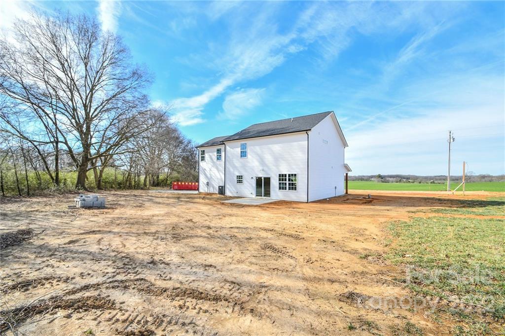 5413 Austin Road, Unit 4 Monroe, NC 28112 - Photo 3 of 22 a view of a house with a yard and large tree