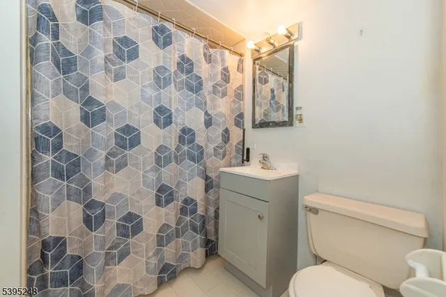 a bathroom with a toilet and a sink