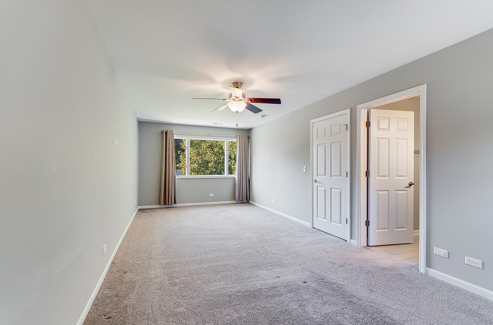 22503 South Deal Avenue Channahon, IL 60410 - Photo 17 of 33 an empty room with a ceiling fan and a window
