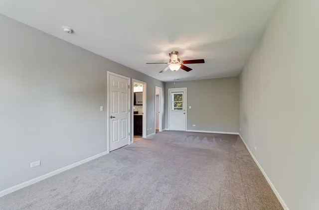 a view of an empty room with a bathroom