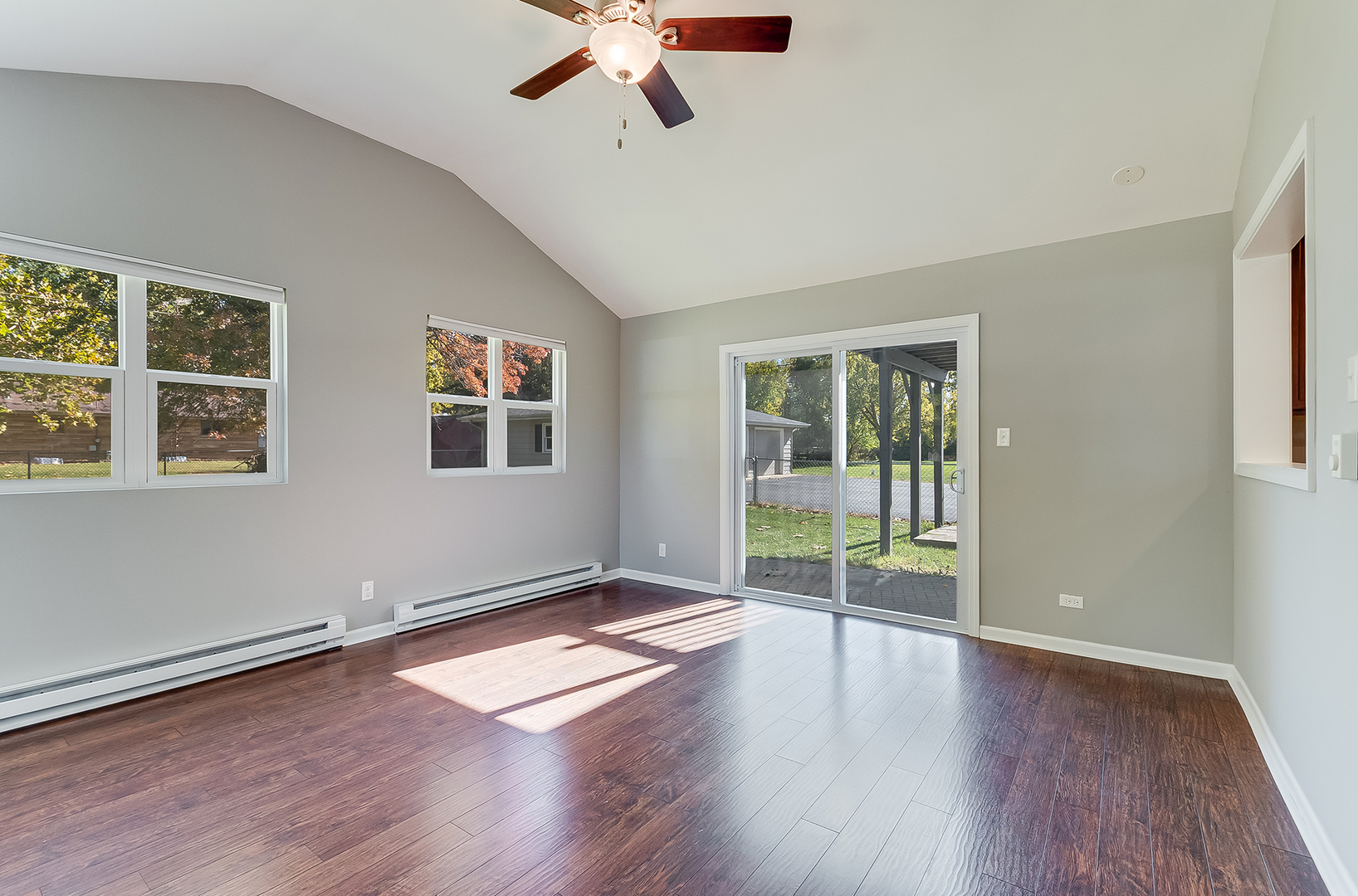 22503 South Deal Avenue Channahon, IL 60410 - Photo 10 of 33 a view of a livingroom with wooden floor and a ceiling fan