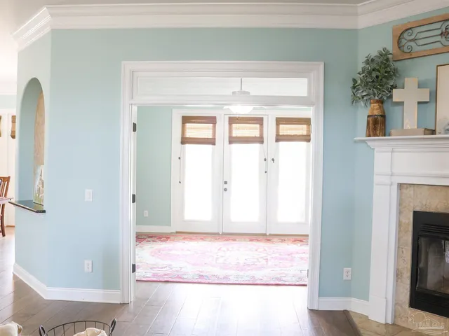a living room with furniture and a lamp