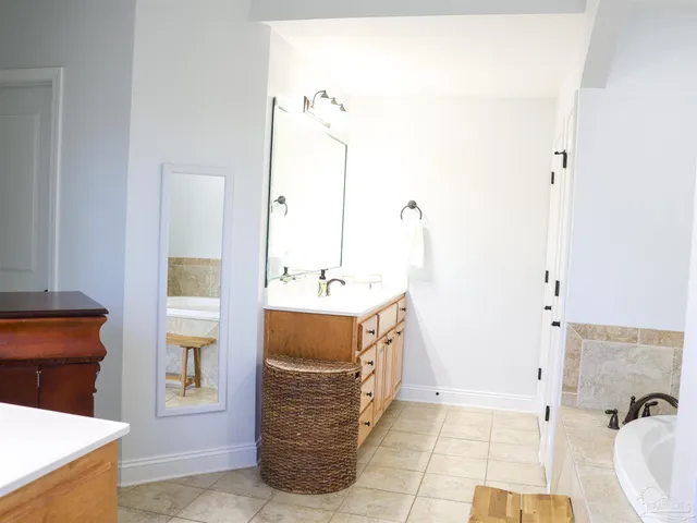a bathroom with a shower and a sink