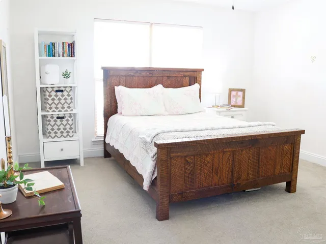 a bedroom with a bed and a dresser