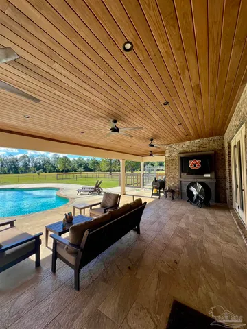 a view of a patio with a table and chairs