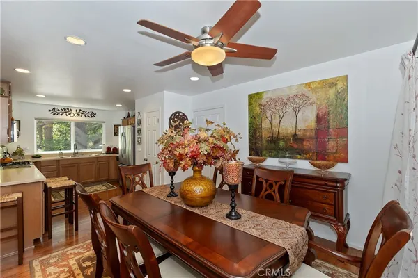 a view of a dining room with furniture and chandelier