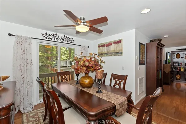 a view of a dining room with furniture and a large window