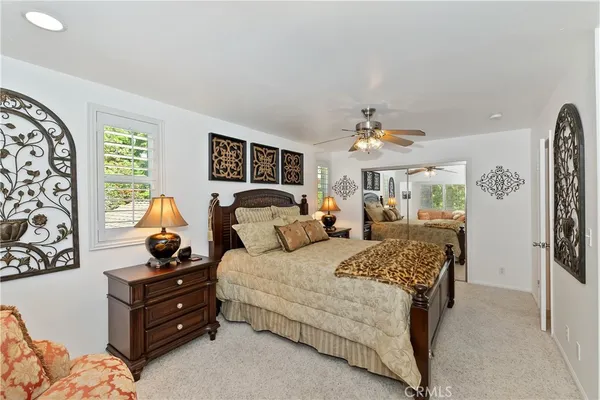 a bedroom with bed and window