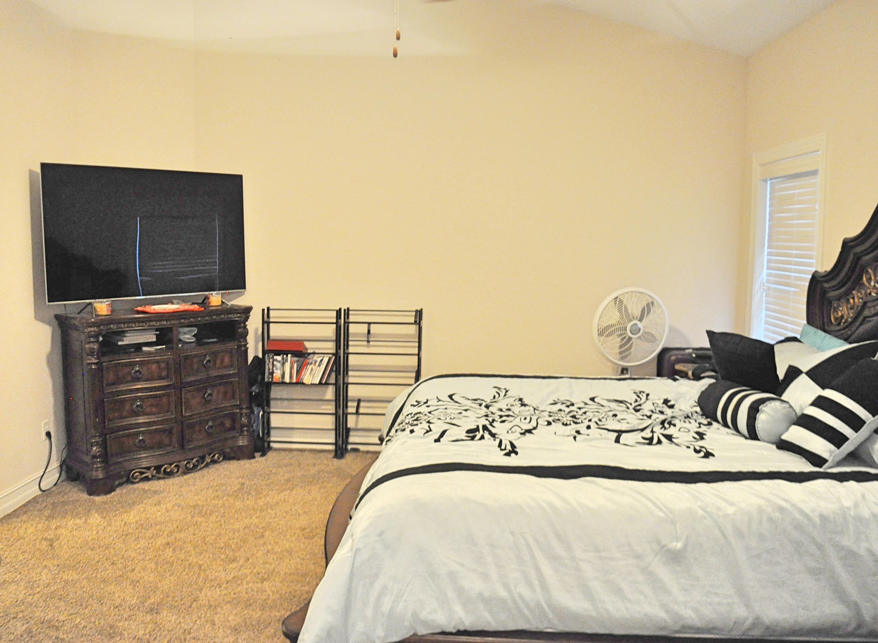 216 Mango Lane Freeport, FL 32439 - Photo 16 of 44 a bedroom with a bed and furniture