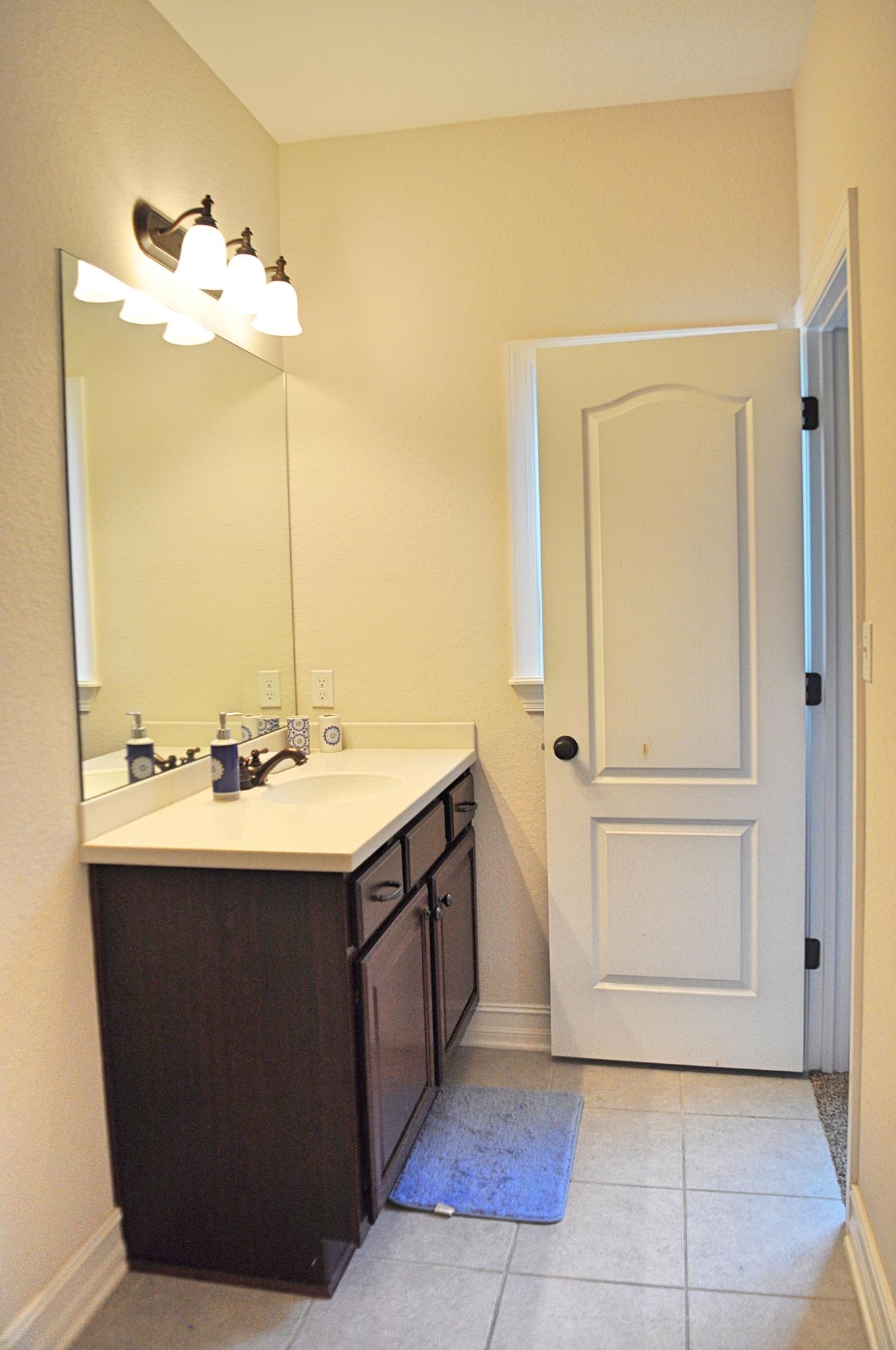 216 Mango Lane Freeport, FL 32439 - Photo 24 of 44 a bathroom with a sink and a mirror