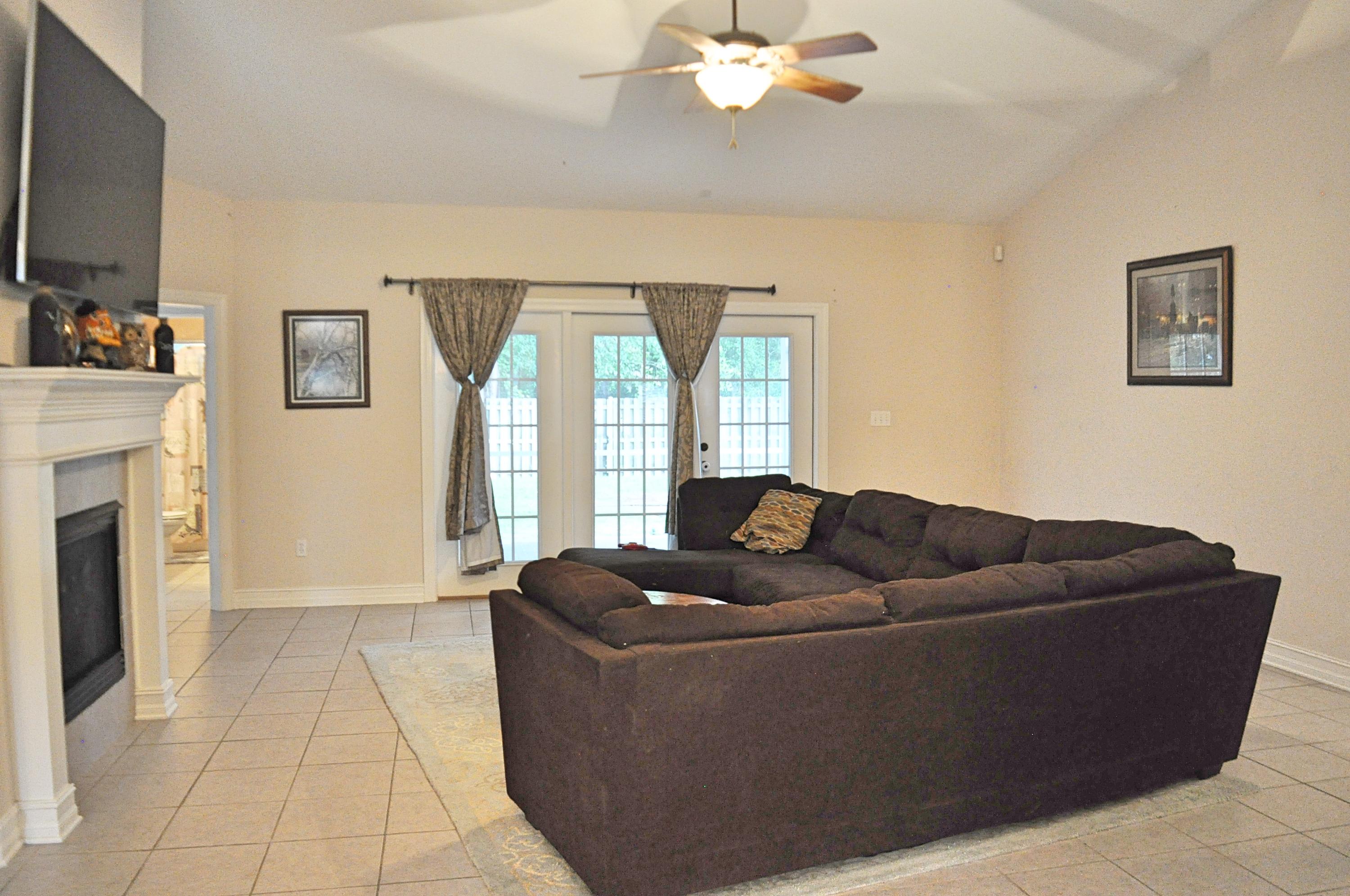 216 Mango Lane Freeport, FL 32439 - Photo 3 of 44 a living room with furniture and a fireplace
