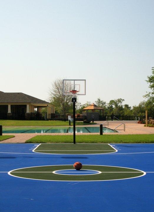 216 Mango Lane Freeport, FL 32439 - Photo 35 of 44 a view of an outdoor space and tennis court