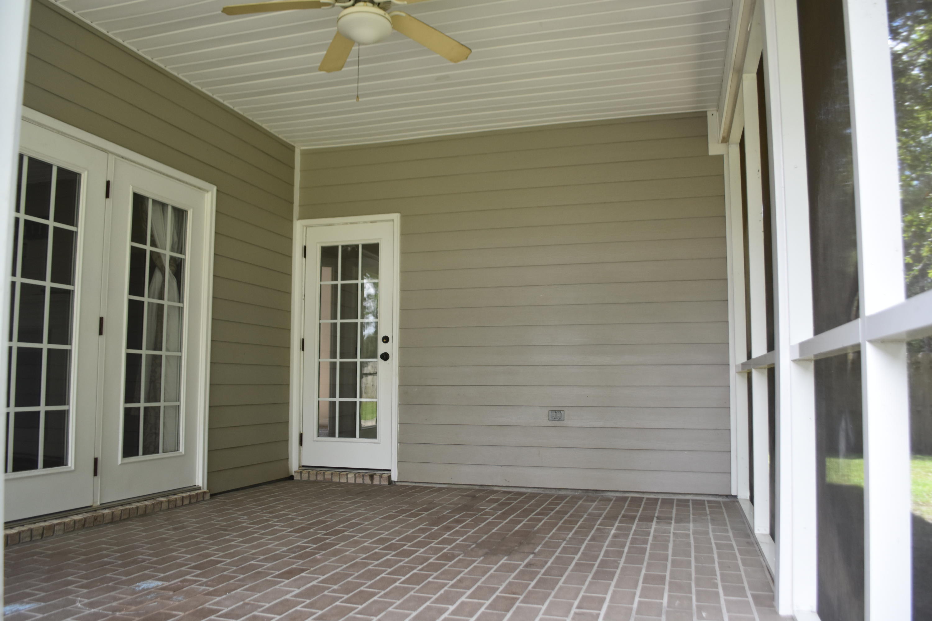 216 Mango Lane Freeport, FL 32439 - Photo 40 of 44 a view of a porch with wooden floor and fence