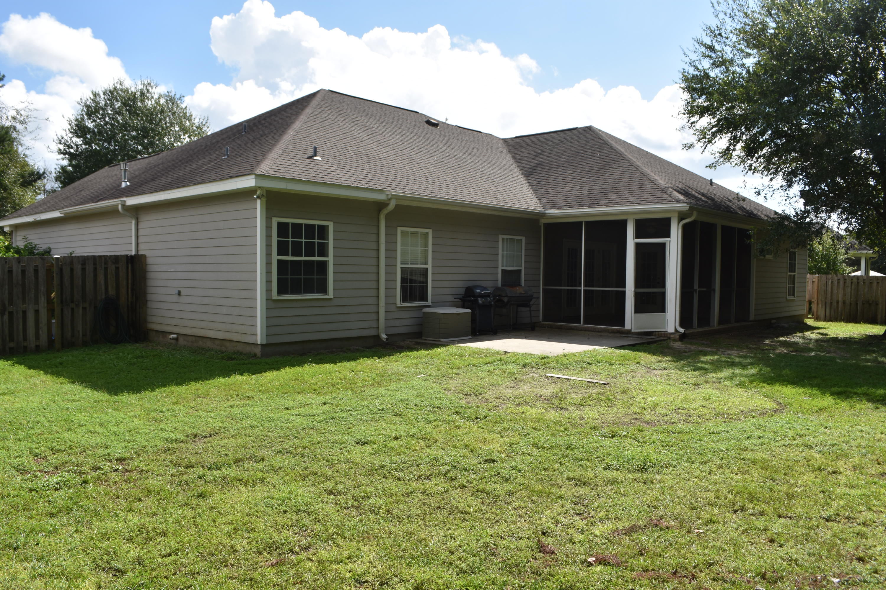 216 Mango Lane Freeport, FL 32439 - Photo 42 of 44 a front view of a house with a yard