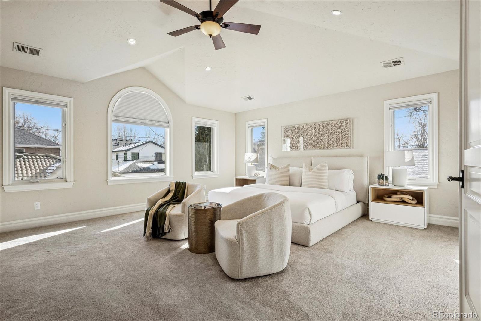 542 Adams Street Denver, CO 80206 - Photo 14 of 31 a bed room with bed and a window