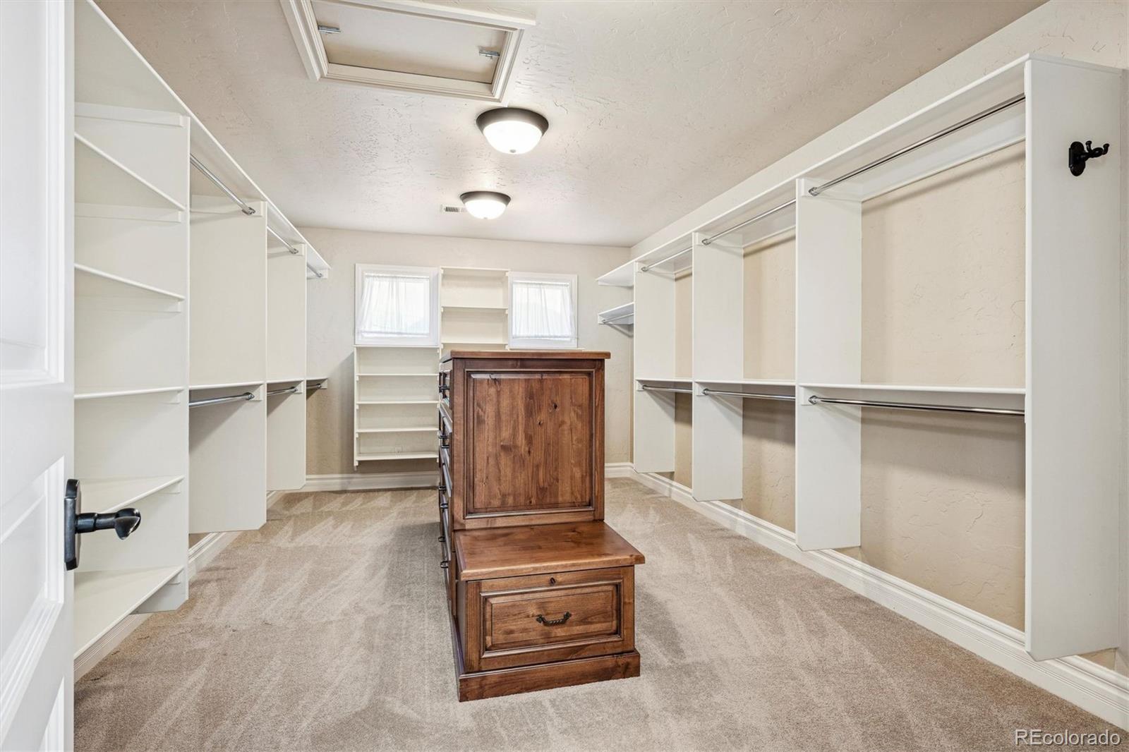 542 Adams Street Denver, CO 80206 - Photo 17 of 31 a view of walk in closet with empty racks