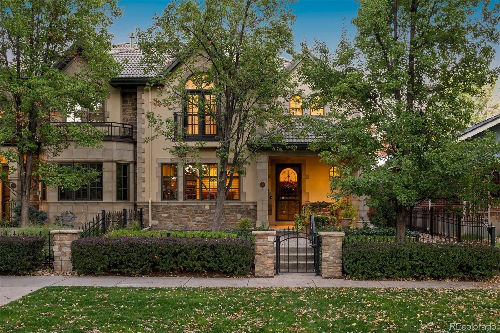 542 Adams Street Denver, CO 80206 - Photo 2 of 31 a front view of a house with a yard