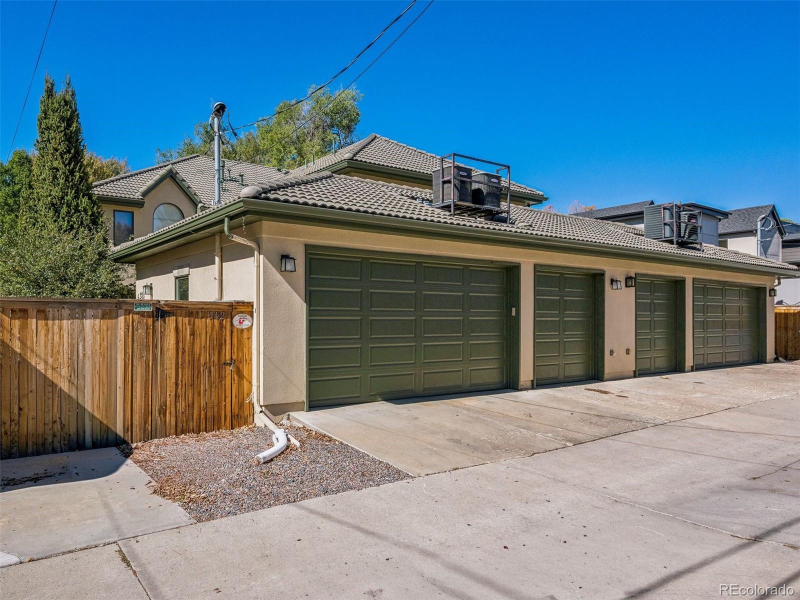 542 Adams Street Denver, CO 80206 - Photo 26 of 31 a front view of a house with a garage