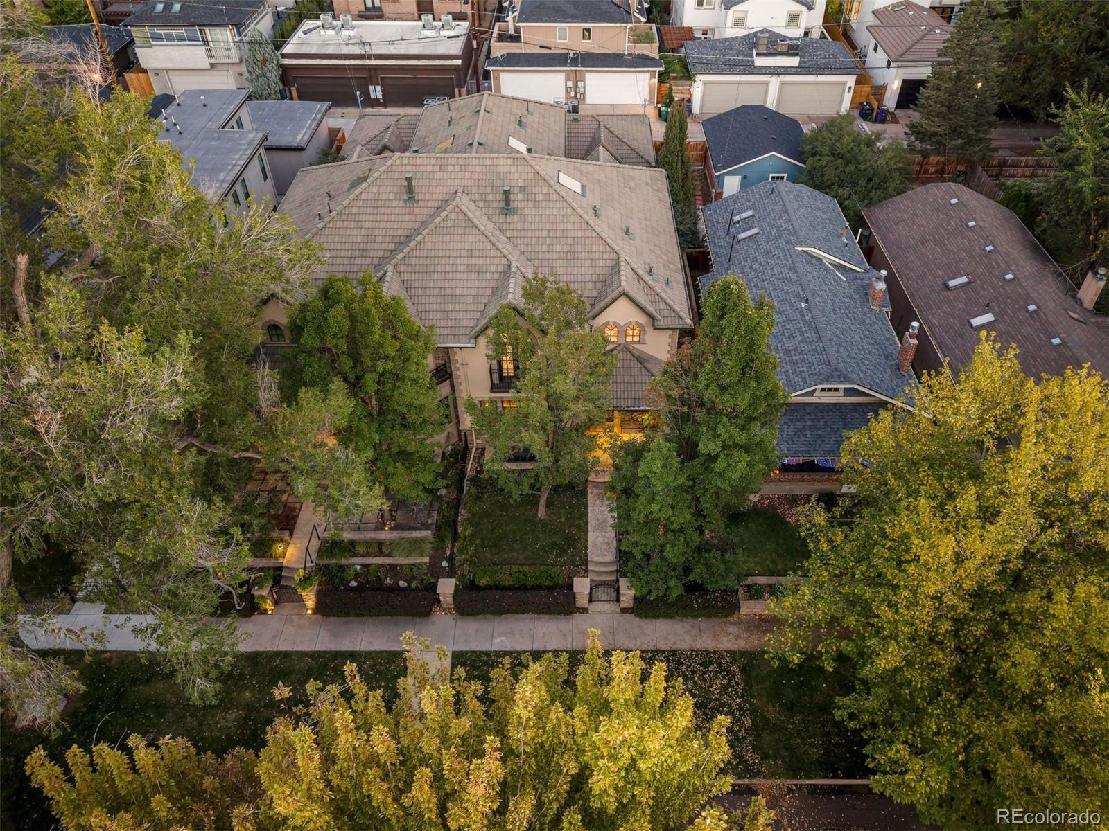 542 Adams Street Denver, CO 80206 - Photo 27 of 31 an aerial view of a house with swimming pool and garden