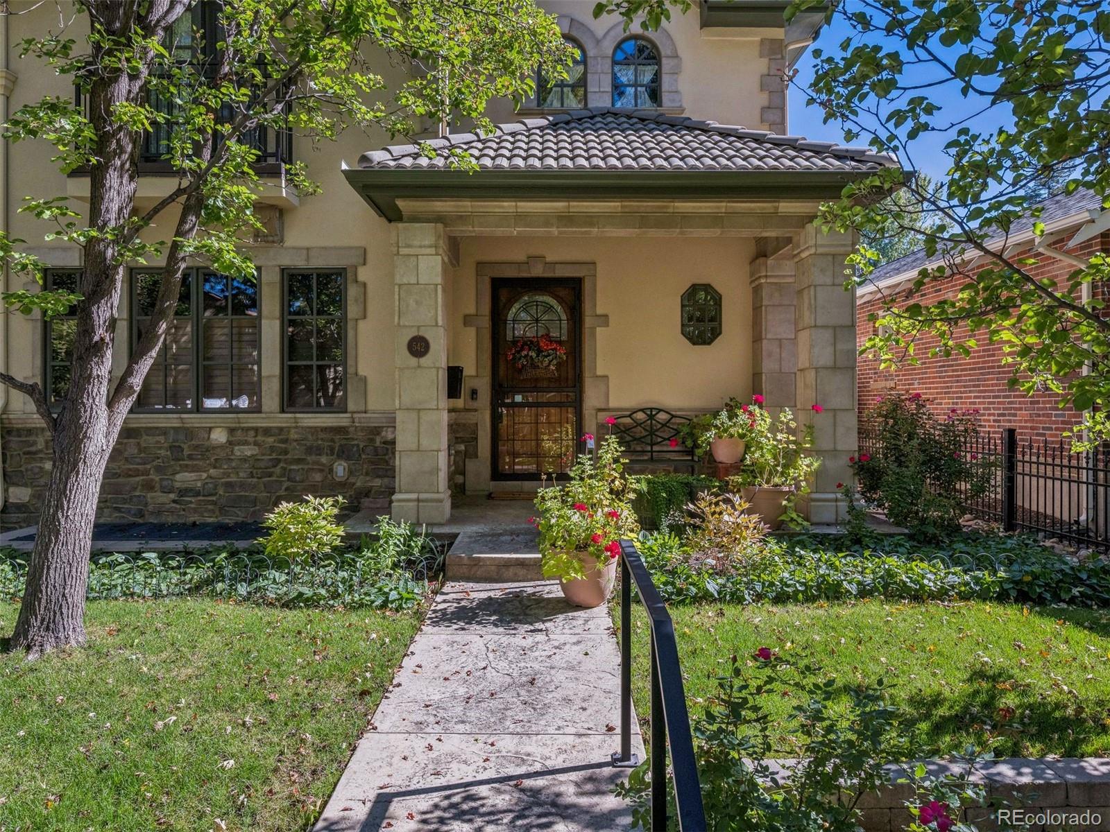542 Adams Street Denver, CO 80206 - Photo 31 of 31 a front view of a house with a yard