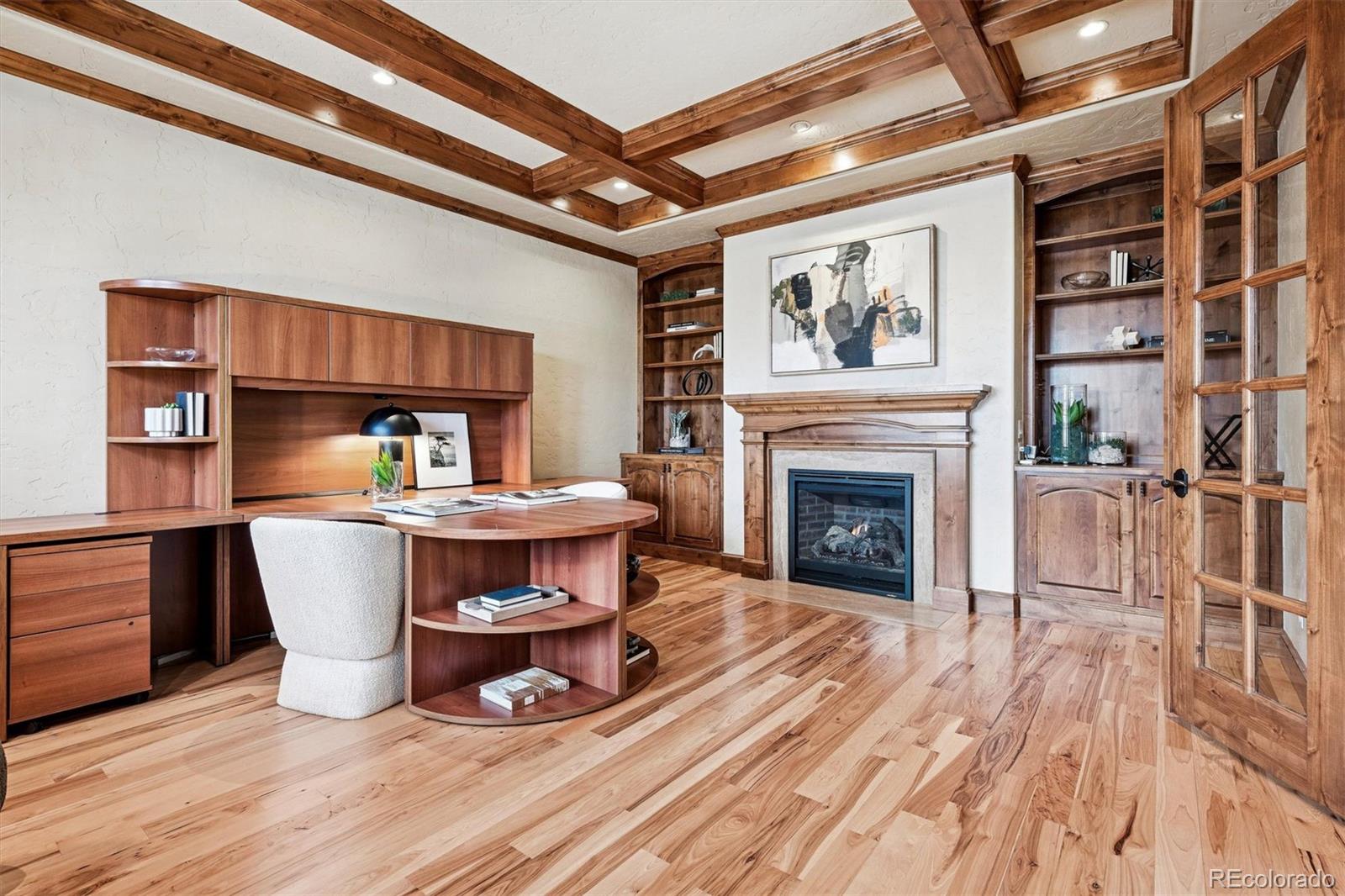 542 Adams Street Denver, CO 80206 - Photo 5 of 31 a living room with stainless steel appliances kitchen island granite countertop furniture and a fireplace