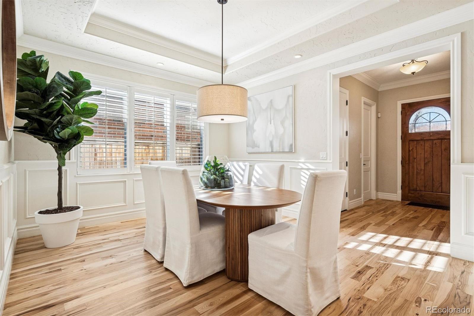 542 Adams Street Denver, CO 80206 - Photo 7 of 31 a living room with furniture and a potted plant