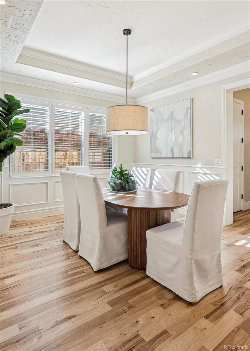 542 Adams Street Denver, CO 80206 - Photo 8 of 31 a view of kitchen with dining area windows and wooden floor