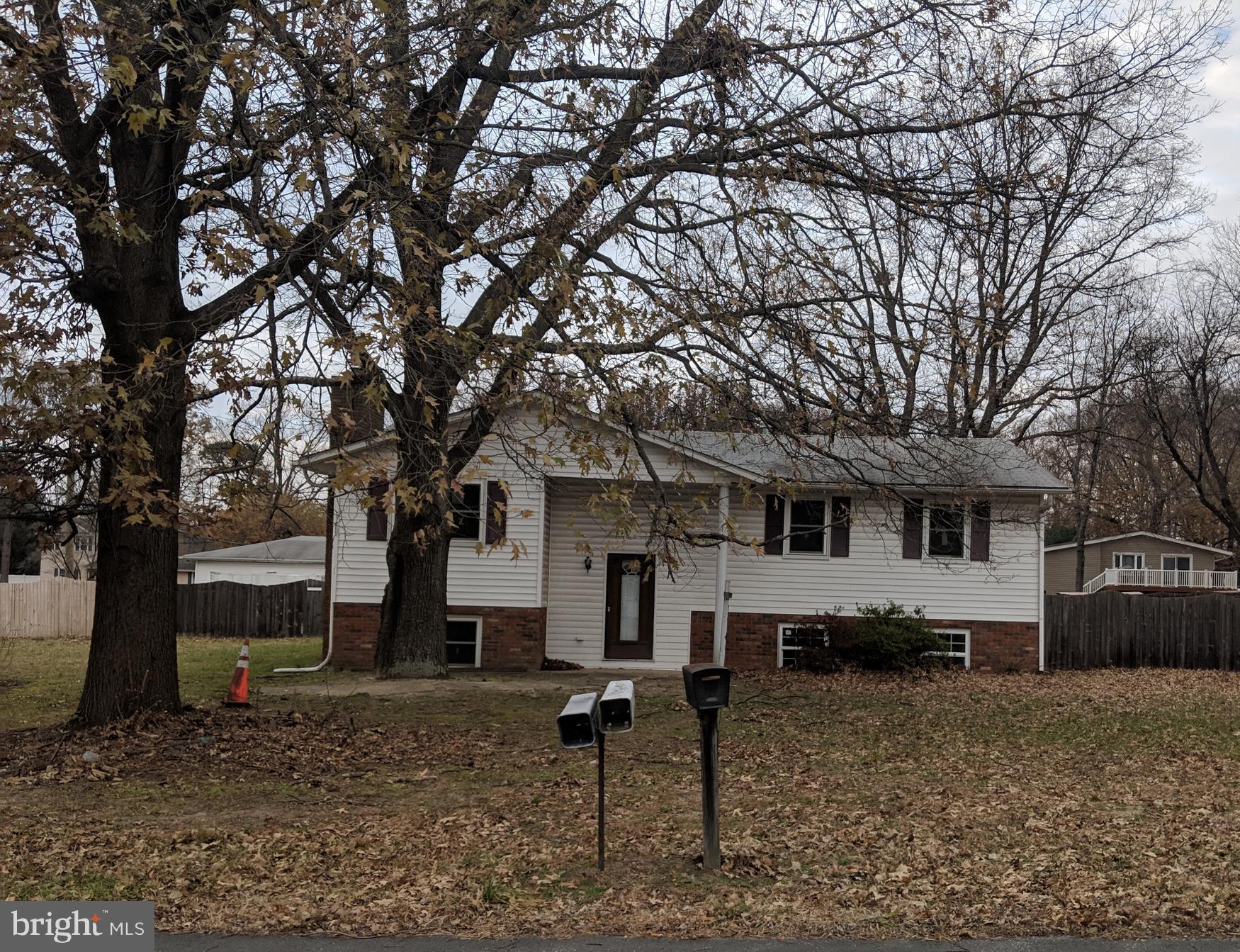 770 Elmhurst Road Severn, MD 21144 - Photo 1 of 26 a house that has a tree in front of the house