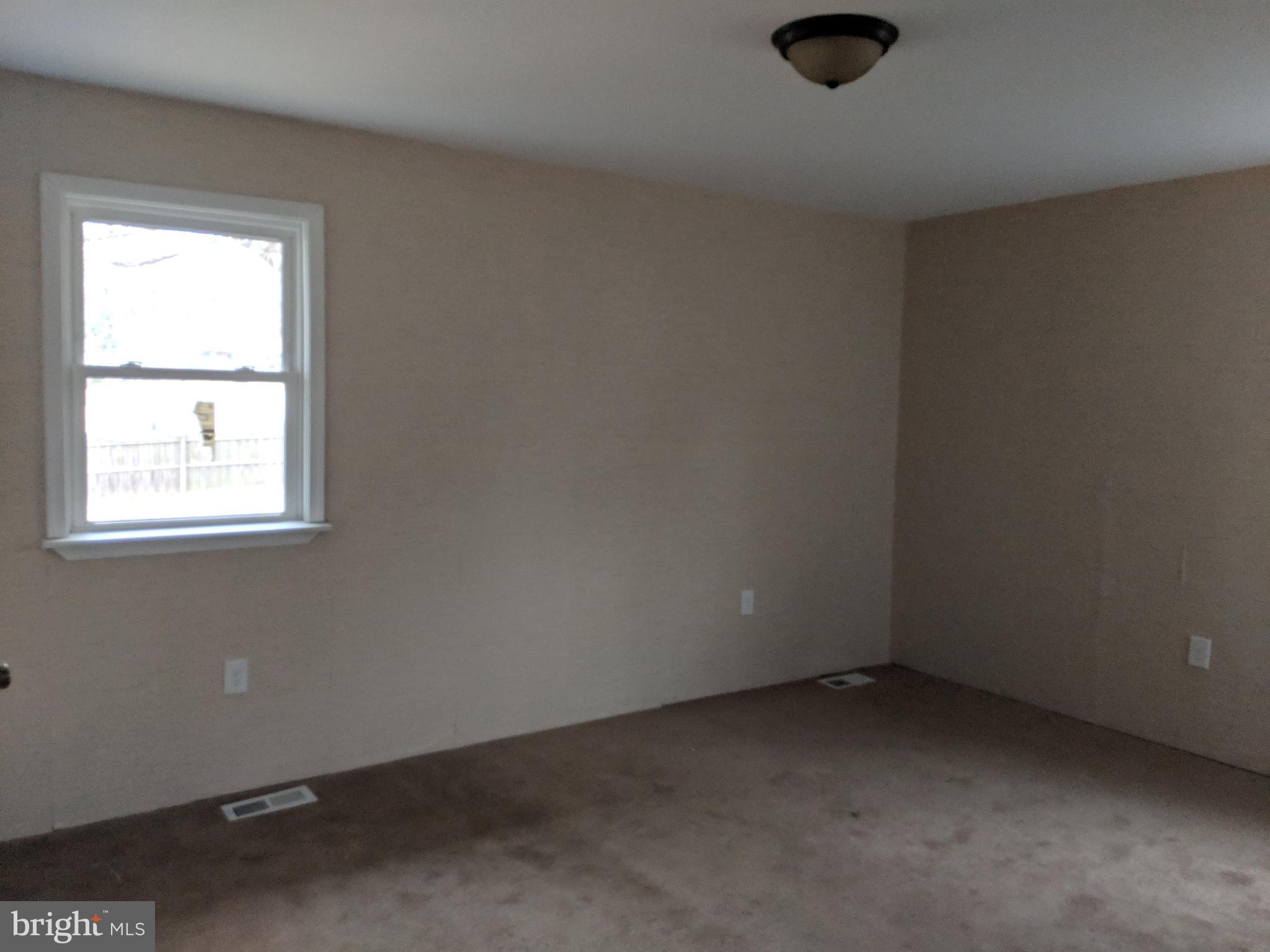 770 Elmhurst Road Severn, MD 21144 - Photo 11 of 26 an empty room with a window