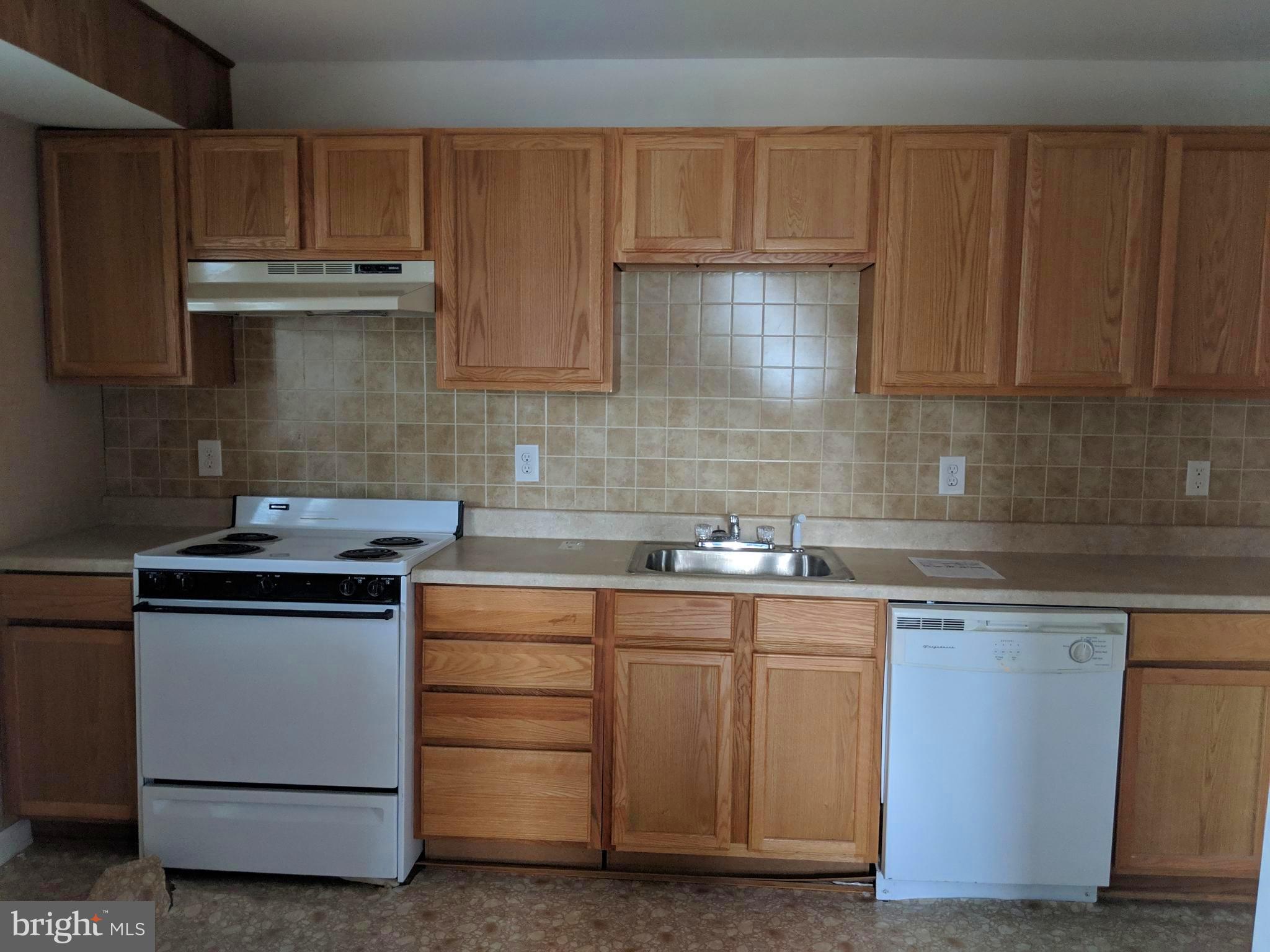 770 Elmhurst Road Severn, MD 21144 - Photo 16 of 26 a kitchen with a stove and a sink