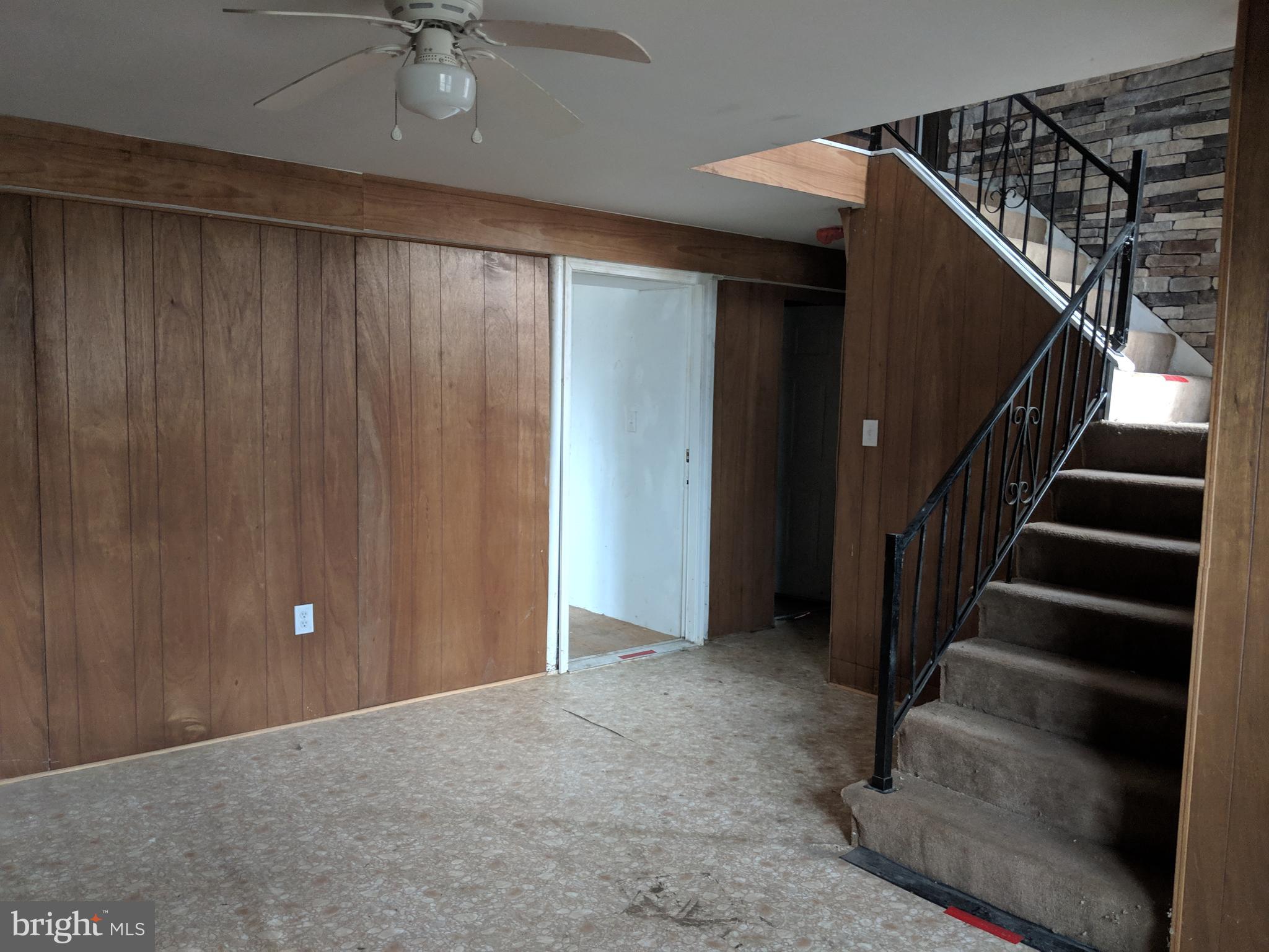 770 Elmhurst Road Severn, MD 21144 - Photo 22 of 26 a view of an empty room with stairs
