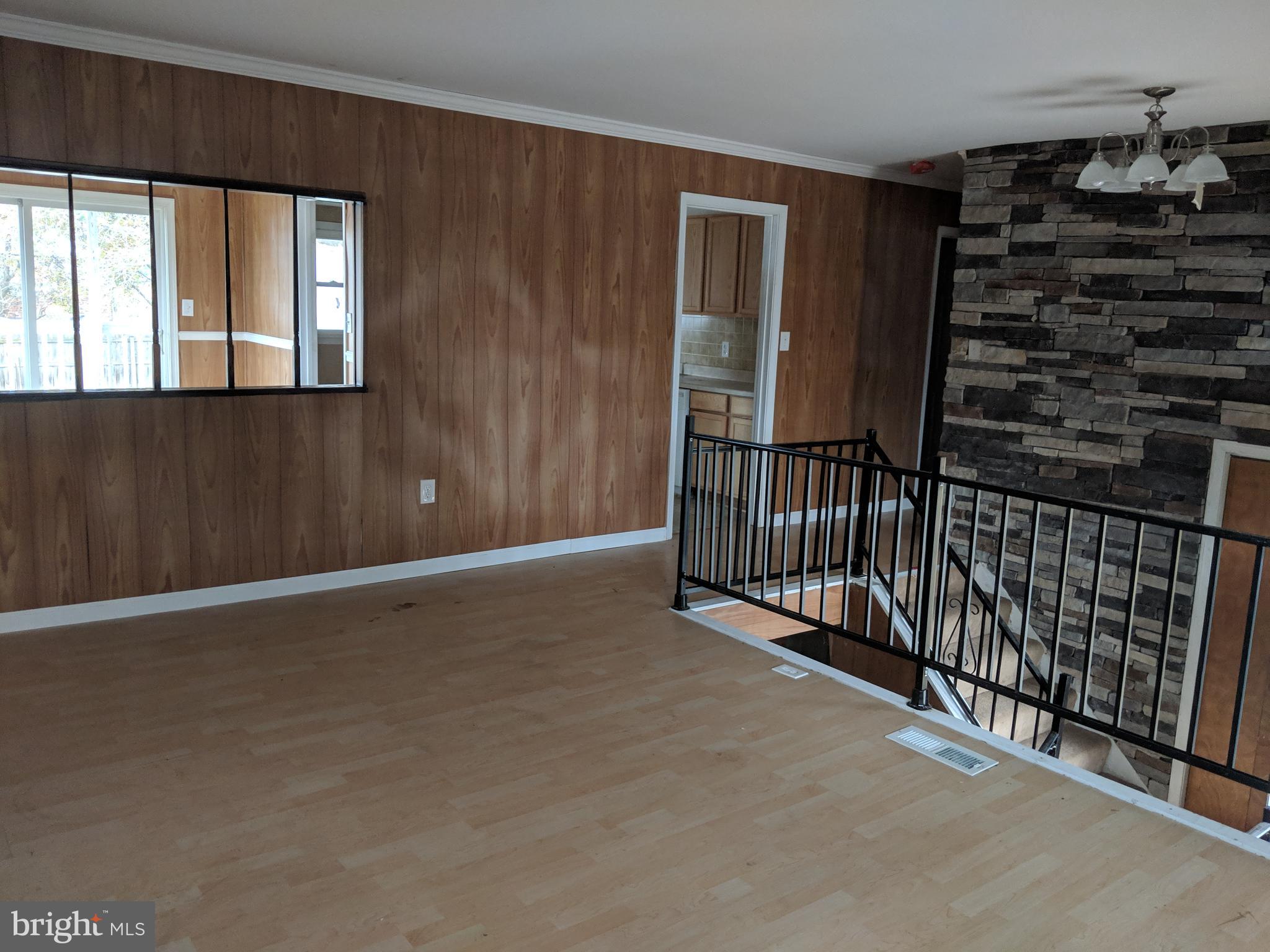 770 Elmhurst Road Severn, MD 21144 - Photo 7 of 26 a view of an empty room with windows