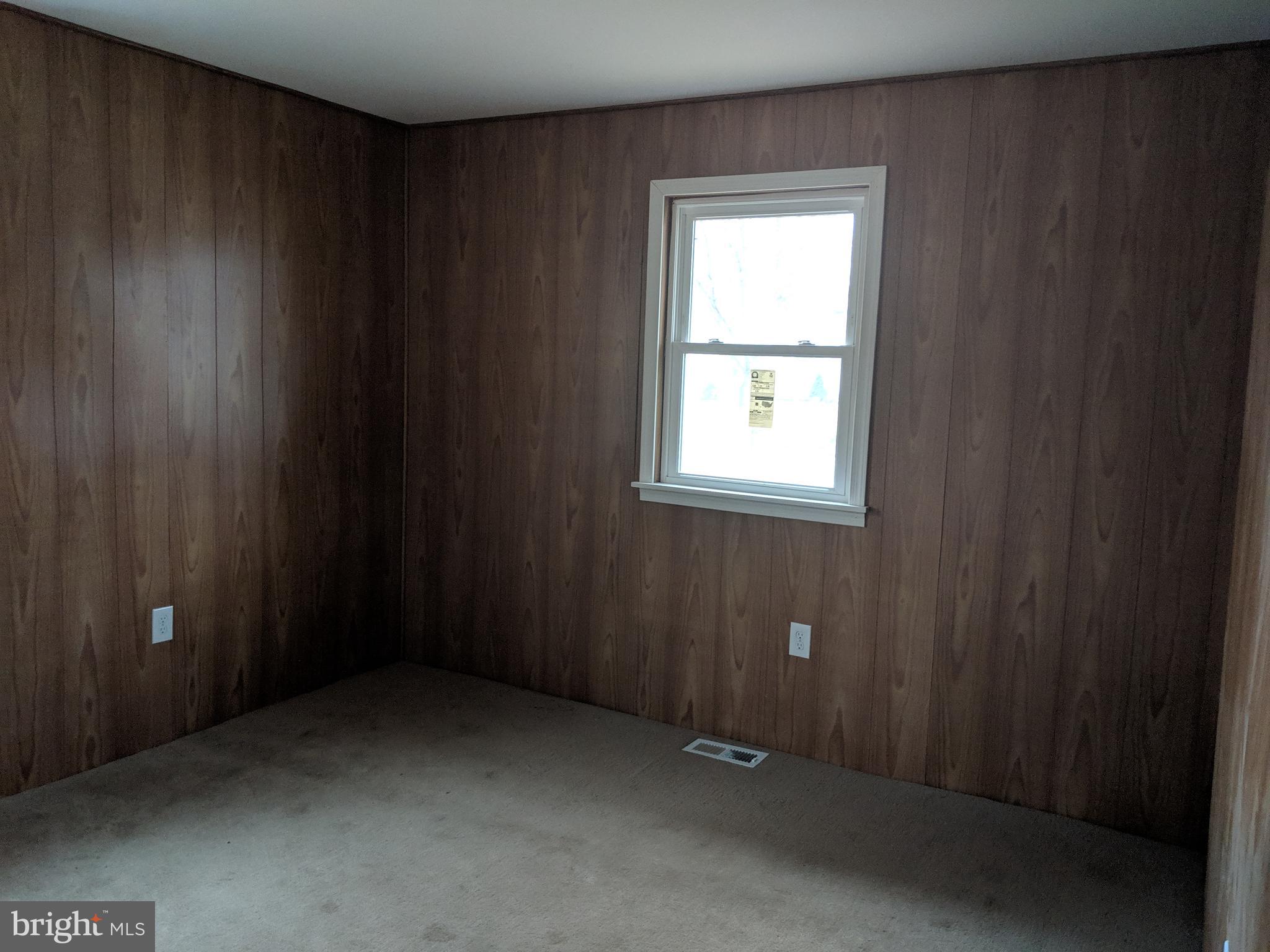 770 Elmhurst Road Severn, MD 21144 - Photo 9 of 26 an empty room with windows
