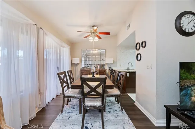 a dining room with furniture and window