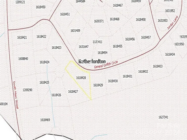 a view of a town with mountains in the background