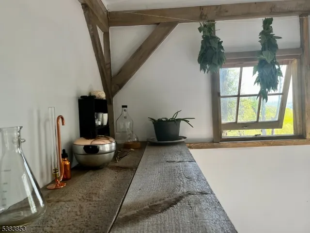 a view of a dining room with furniture and windows