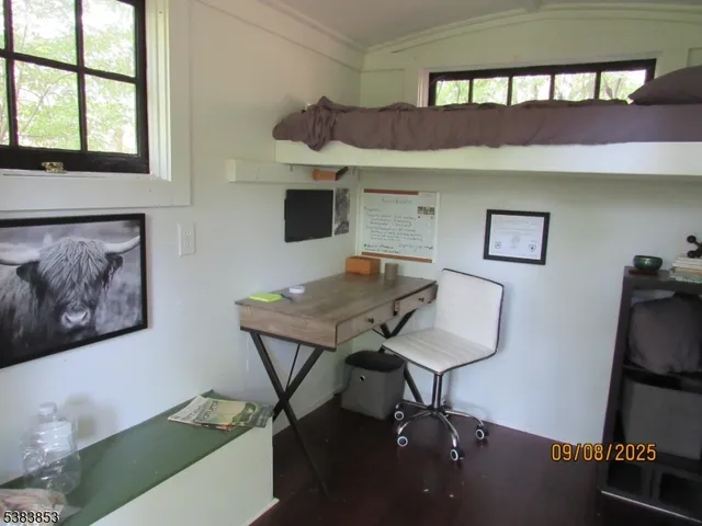 a backyard of a house with lots of trees