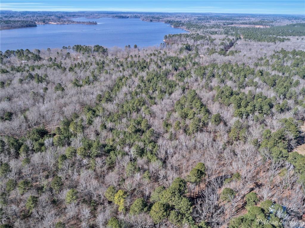 0 East Linton Road Benton, LA 71006 - Photo 20 of 29 a view of a field with trees and wooden fence