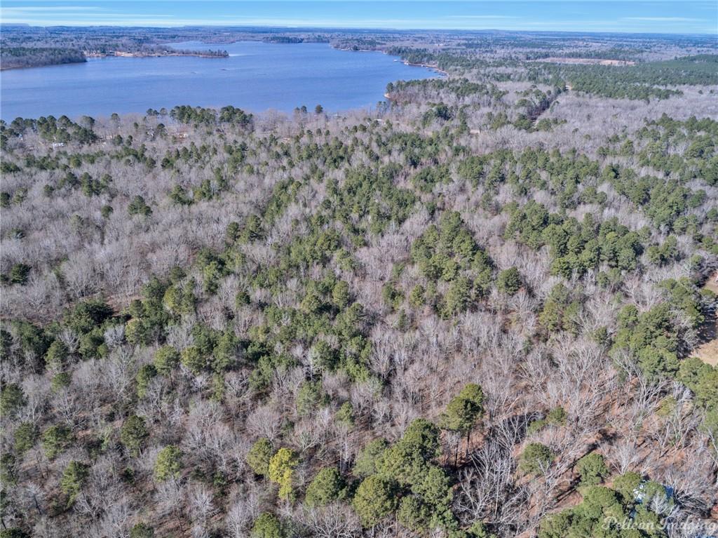0 East Linton Road Benton, LA 71006 - Photo 22 of 29 a view of a field with trees and wooden fence